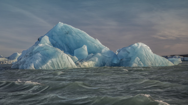 Iceberg ocean waves cloudy sky free wallpaper for desktop - medium preview image