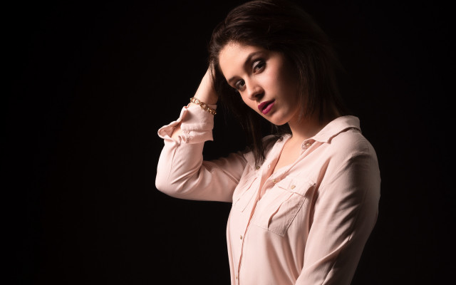 Woman pink shirt holding hair free wallpaper for desktop - medium preview image