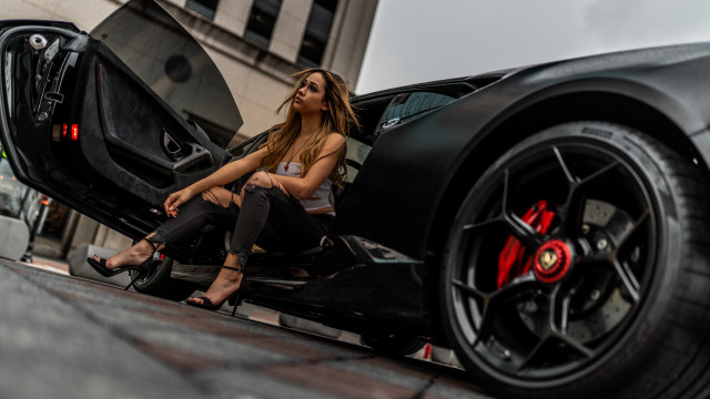 Woman sitting black sports car free wallpaper for desktop - medium preview image