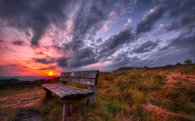 Bench hillside grass sunset cloudy free wallpaper for desktop - medium preview image