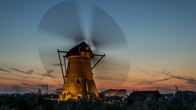 Windmill sunset blurry ecological art free wallpaper for desktop - medium preview image