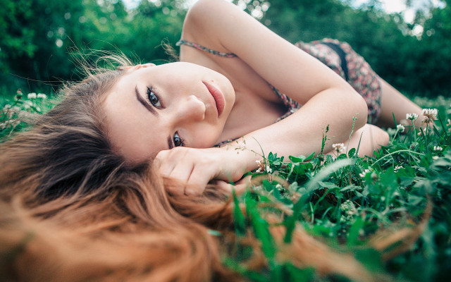 Woman blowing hair on grass free wallpaper for desktop - medium preview image