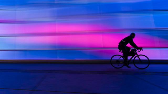 Man bike street tallbuilding colorfulsky free wallpaper for desktop - medium preview image