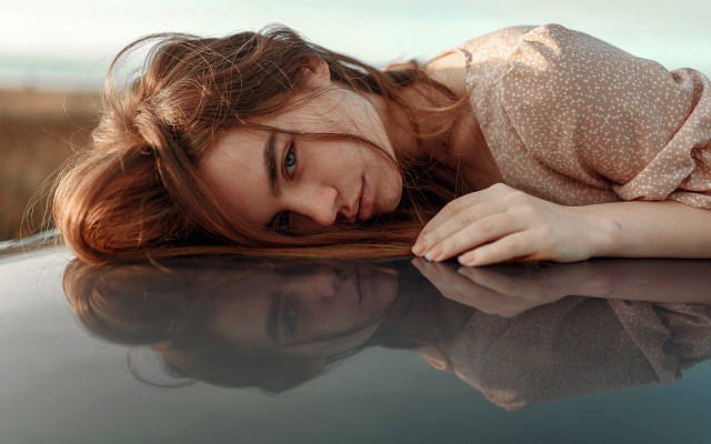 Woman laying on car hood free wallpaper for desktop - medium preview image