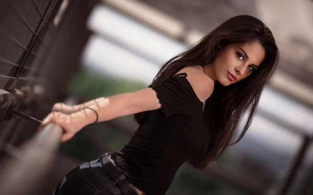 Woman longhair blackshirt outstretched pose free wallpaper for desktop - medium preview image
