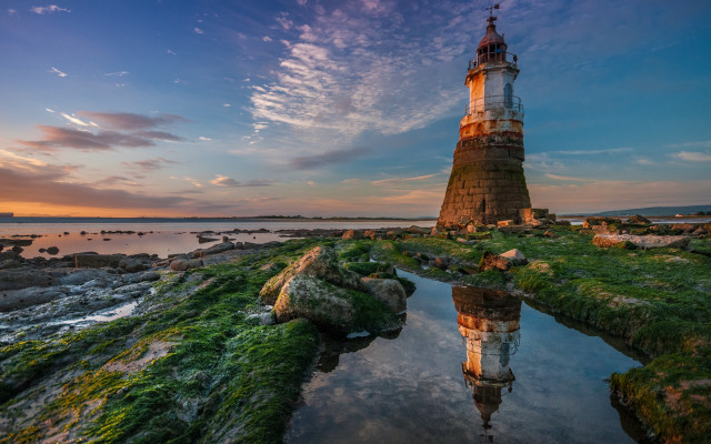 Lighthouse rocky shore sunset magic free wallpaper for desktop - medium preview image