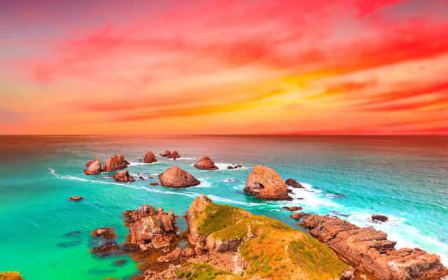 Sunset ocean rocks water red free wallpaper for desktop - medium preview image