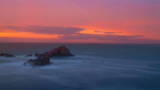 Sunset rocks ocean pink sky free wallpaper for desktop - medium preview image