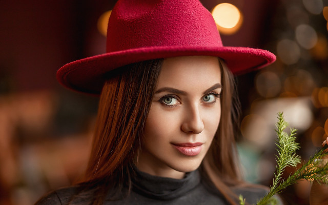 Woman redhat blackshirt plant portrait free wallpaper for desktop - medium preview image