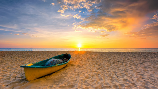 Boat sunset beach clouds horizon free wallpaper for desktop - medium preview image