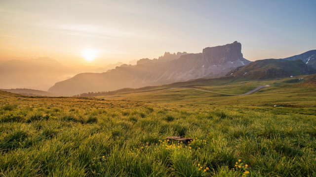 Grassy field mountain sunset trail free wallpaper for desktop - medium preview image