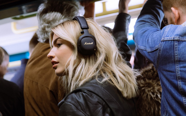 Woman headphones subway blonde coat free wallpaper for desktop - medium preview image