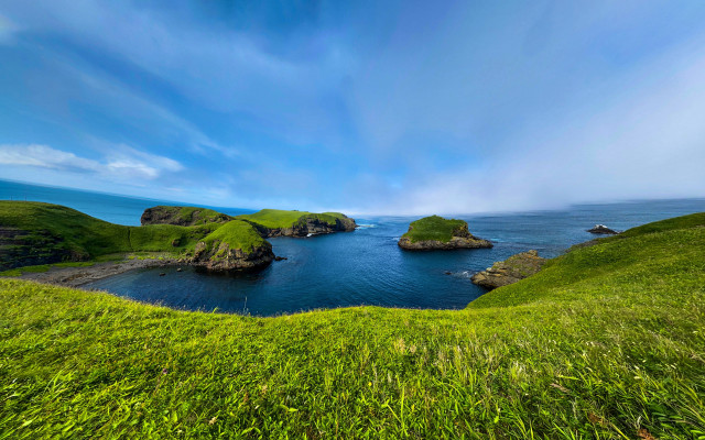 Grassy hill lake islands nature free wallpaper for desktop - medium preview image