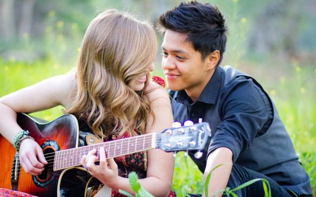 Man woman grass guitar playing free wallpaper for desktop - medium preview image