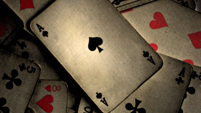 Pile of playing cards with free wallpaper for desktop - medium preview image