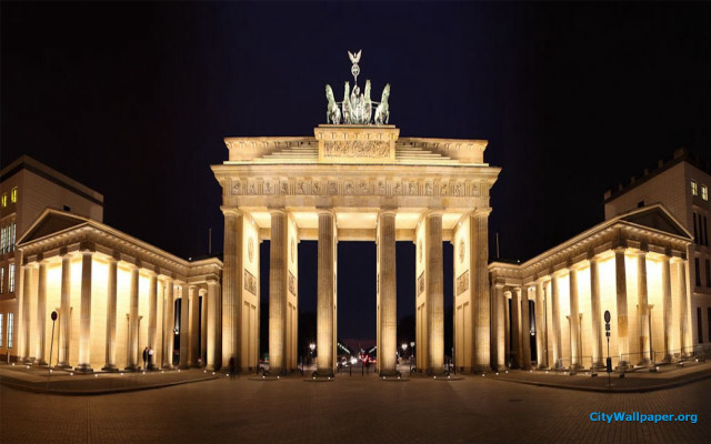 Large building statue nighttime lights free wallpaper for desktop - medium preview image