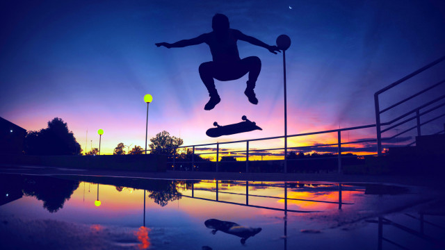 Skateboarder jumping sunset reflection graffiti free wallpaper for desktop - medium preview image