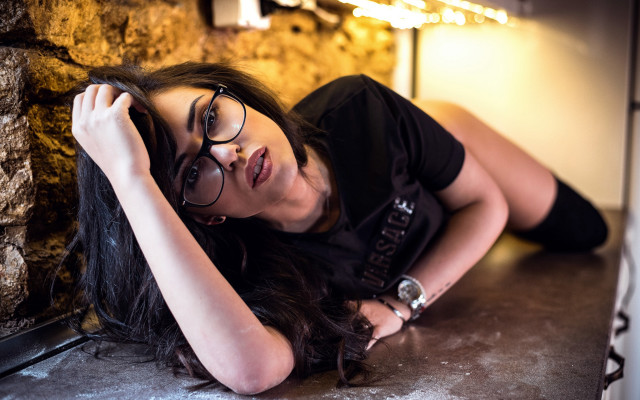 Woman glasses laying blurry cave free wallpaper for desktop - medium preview image