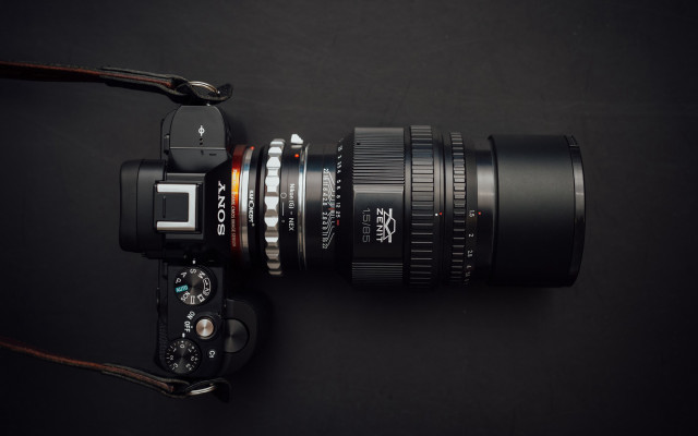 Camera lens strap black surface free wallpaper for desktop - medium preview image