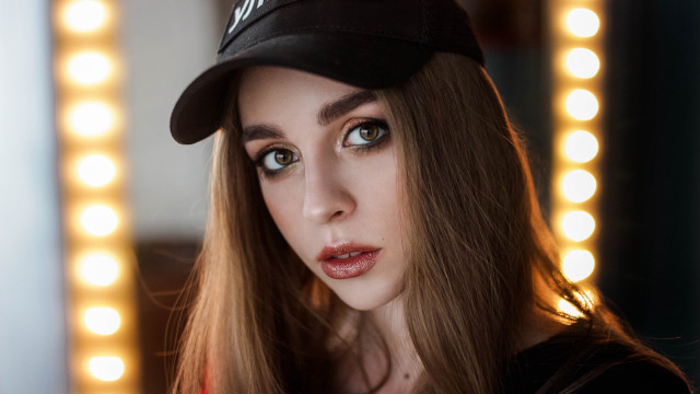 Woman baseballcap mirror lights portrait free wallpaper for desktop - medium preview image