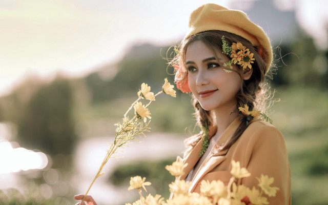 Woman flower hair holding flower free wallpaper for desktop - medium preview image