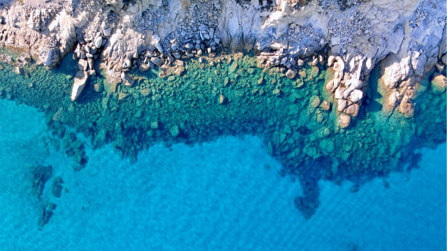 Rocky coastline aerial view boat free wallpaper for desktop - medium preview image