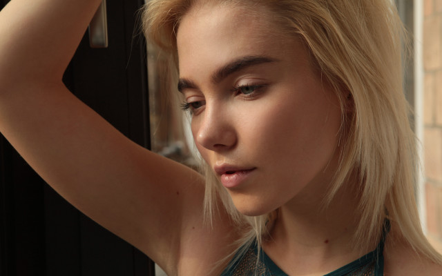 Blonde woman window hair pose free wallpaper for desktop - medium preview image