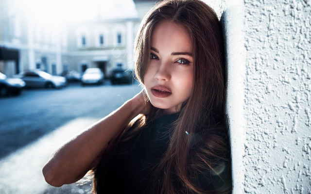 Woman leaning wall serious portrait #7 free wallpaper for desktop - medium preview image