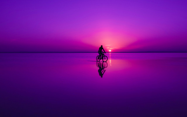 Person riding bike purple sunset free wallpaper for desktop - medium preview image
