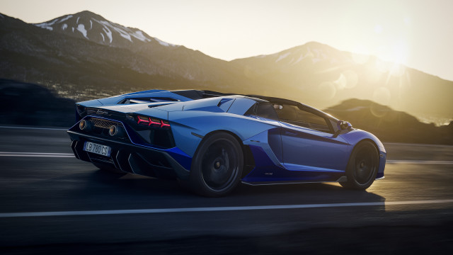 Blue sports car mountains sunset free wallpaper for desktop - medium preview image