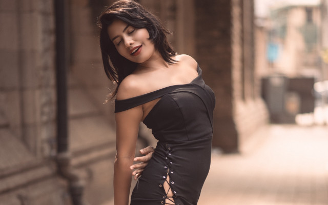 Woman black dress street pose free wallpaper for desktop - medium preview image