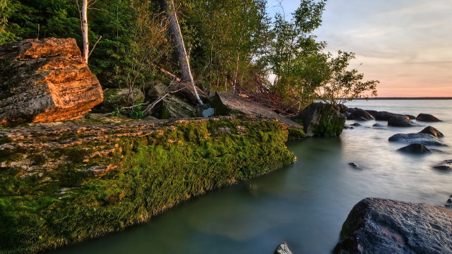 River rocks trees sunset boat free wallpaper for desktop - medium preview image