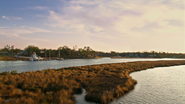 River boat grassy sunset cityscape free wallpaper for desktop - medium preview image