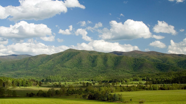 Green field mountains clouds blue free wallpaper for desktop - medium preview image