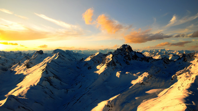 Snowy mountain range cloudy sunset free wallpaper for desktop - medium preview image