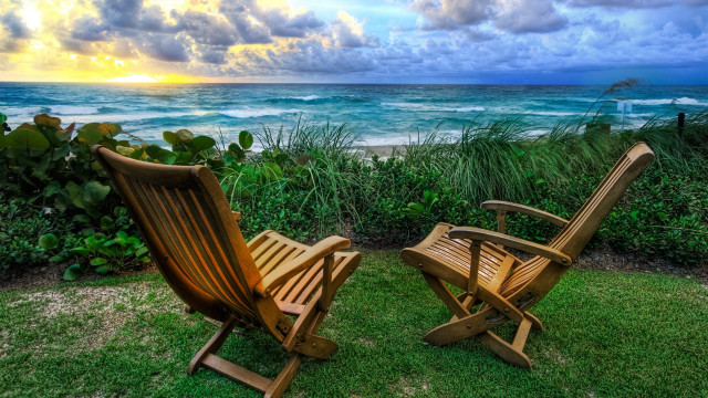 Wooden chairs lush green ocean free wallpaper for desktop - medium preview image