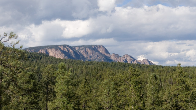 Mountain range trees clouds blue #2 free wallpaper for desktop - medium preview image