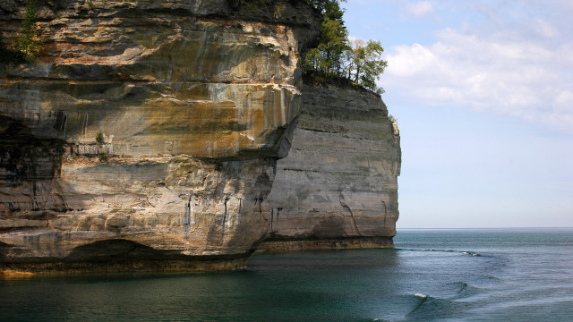 Surfboard cliff tree polarizing blue free wallpaper for desktop - medium preview image