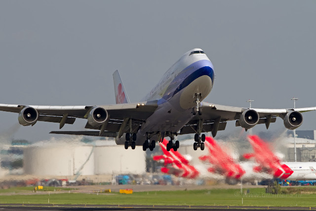 Jetliner cloudy sky runway flags free wallpaper for desktop - medium preview image