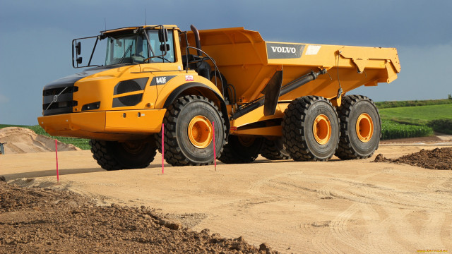 Yellow dump truck dirt field free wallpaper for desktop - medium preview image
