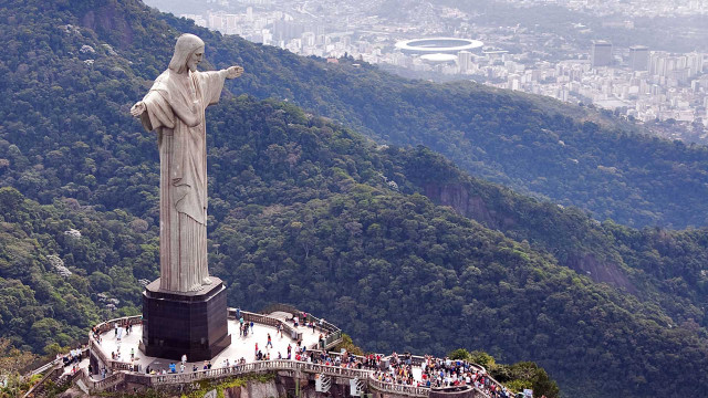 Jesus statue city mountain crowd free wallpaper for desktop - medium preview image