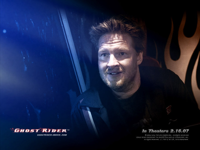 Smiling man chair fire ghost free wallpaper for desktop - medium preview image