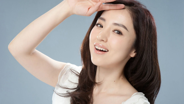 Woman long hair smiling touching free wallpaper for desktop - medium preview image