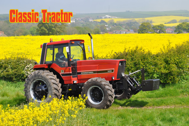 Classic tractor parked field yellow free wallpaper for desktop - medium preview image