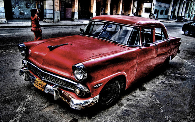 Old red car parked city free wallpaper for desktop - medium preview image