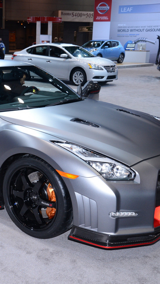 Silver sports car showroom man free wallpaper for mobile - medium preview image