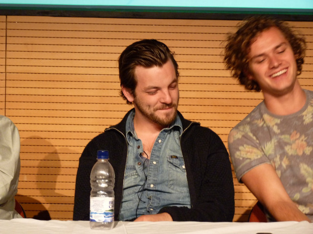 Three men sitting table water free wallpaper for desktop - medium preview image