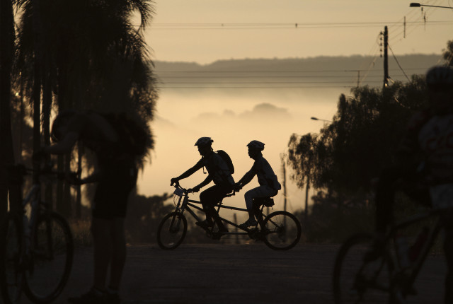 Biking group forest fog sunset free wallpaper for desktop - medium preview image