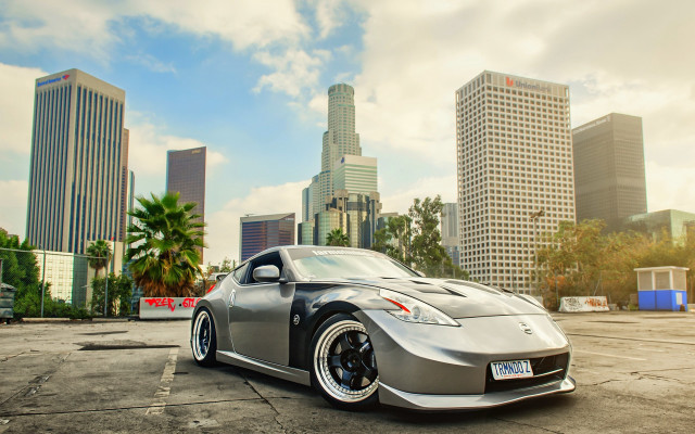 Silver sports car tokyo cityscape free wallpaper for desktop - medium preview image