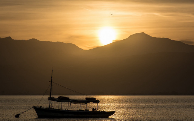 Boat lake sunset mountains bird free wallpaper for desktop - medium preview image